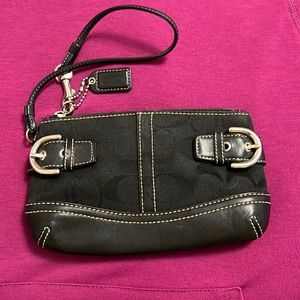 Awesome black Coach wristlet. Perfect for all of your necessities.